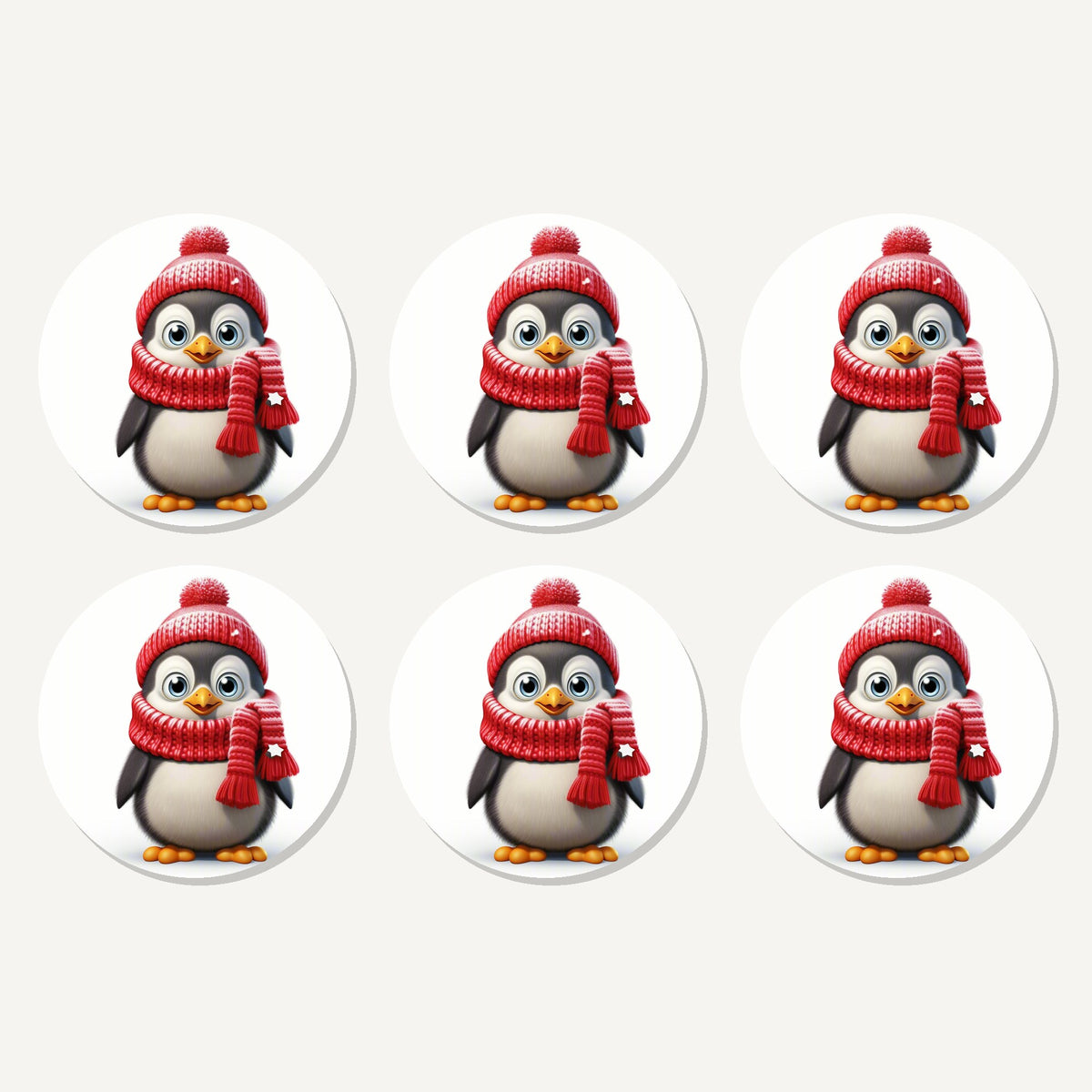 Flat lay of the cheerful penguin in red hat & scarf artwork on six round coasters