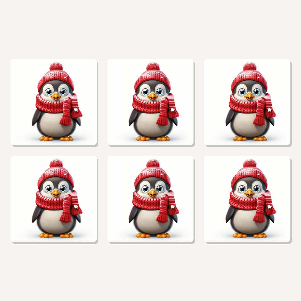 Flat lay of the cheerful penguin in red hat & scarf artwork on six square coasters