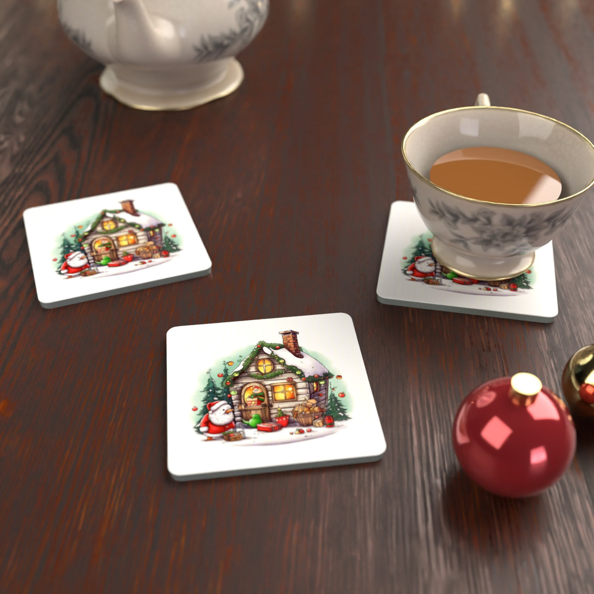 Christmas Cottage with Father Christmas Square Glass Coasters – Set of 6 – lifestyle mockup with a teacup