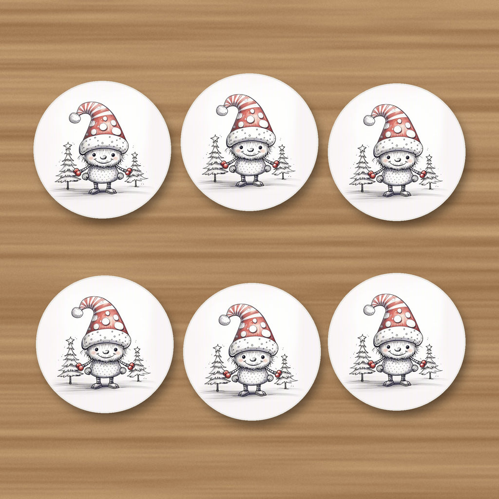 Sketch Snow Sprite in a Spotty Hat round ceramic coasters, set of 6, on an oak coffee table