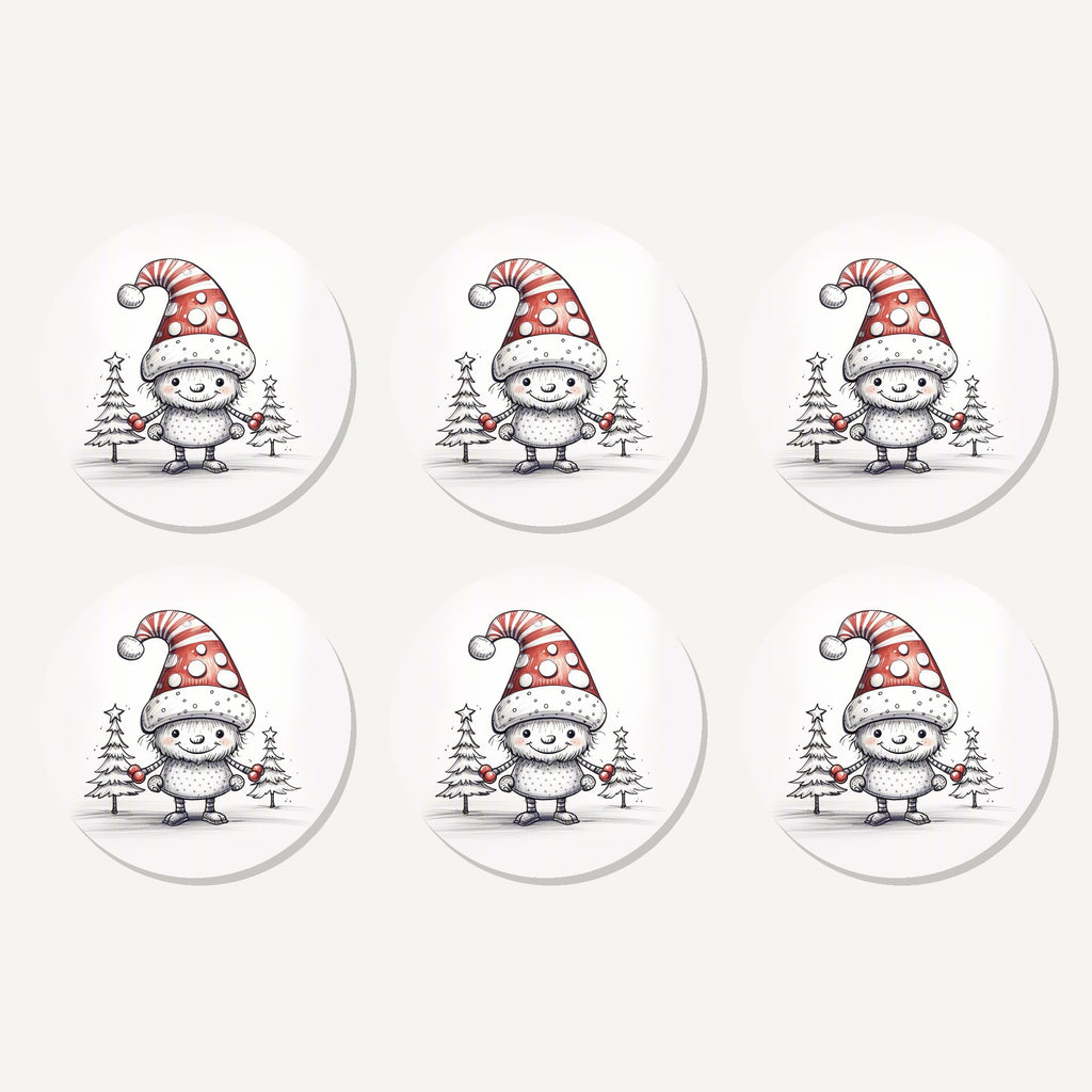 Flat lay of the sketch snow sprite in a spotty hat artwork on six round coasters