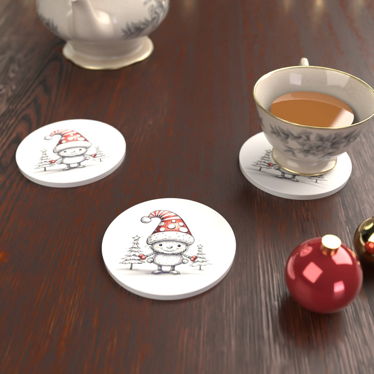 Sketch Snow Sprite in a Spotty Hat Round Ceramic Coasters – Set of 6 – lifestyle mockup with a teacup