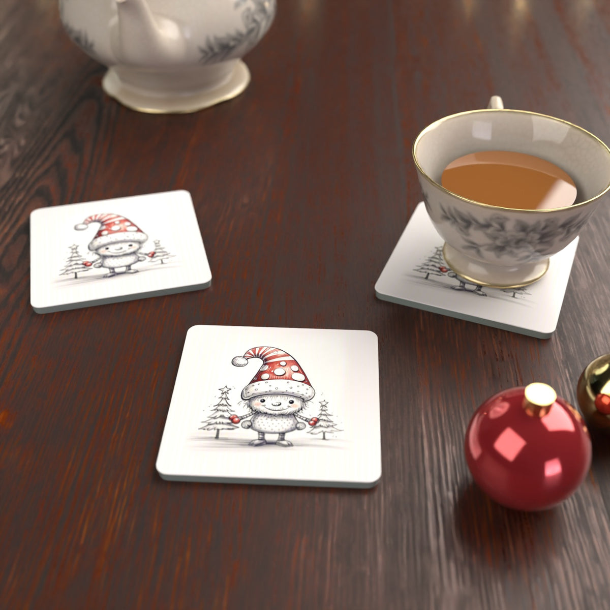 Sketch Snow Sprite in a Spotty Hat Square Glass Coasters – Set of 6 – lifestyle mockup with a teacup