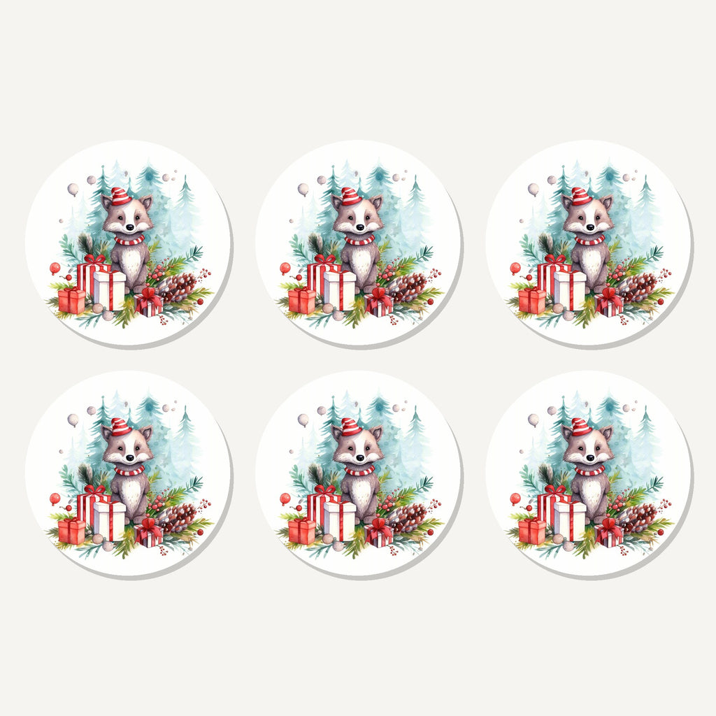 Flat lay of the christmas woodland animal with presents artwork on six round coasters