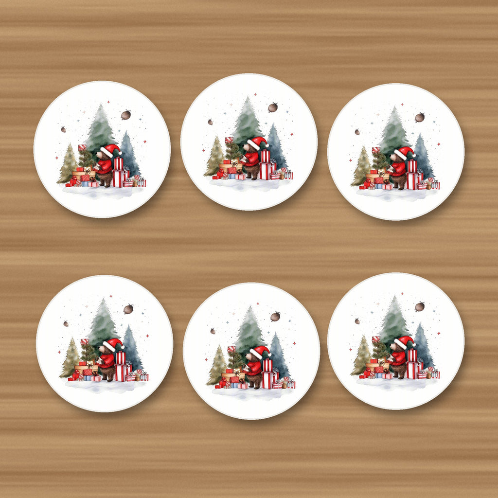 Little Bear with Christmas Presents round ceramic coasters, set of 6, on an oak coffee table