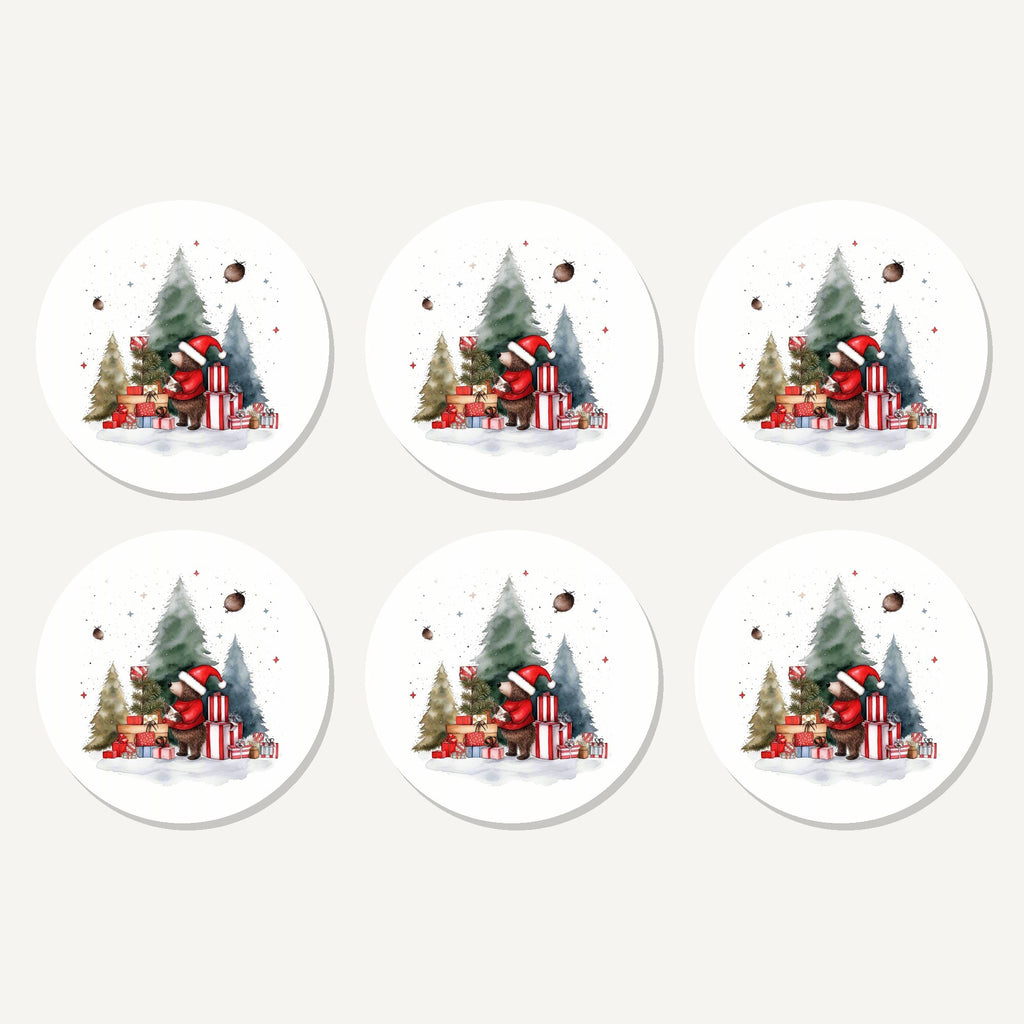 Flat lay of the little bear with christmas presents artwork on six round coasters