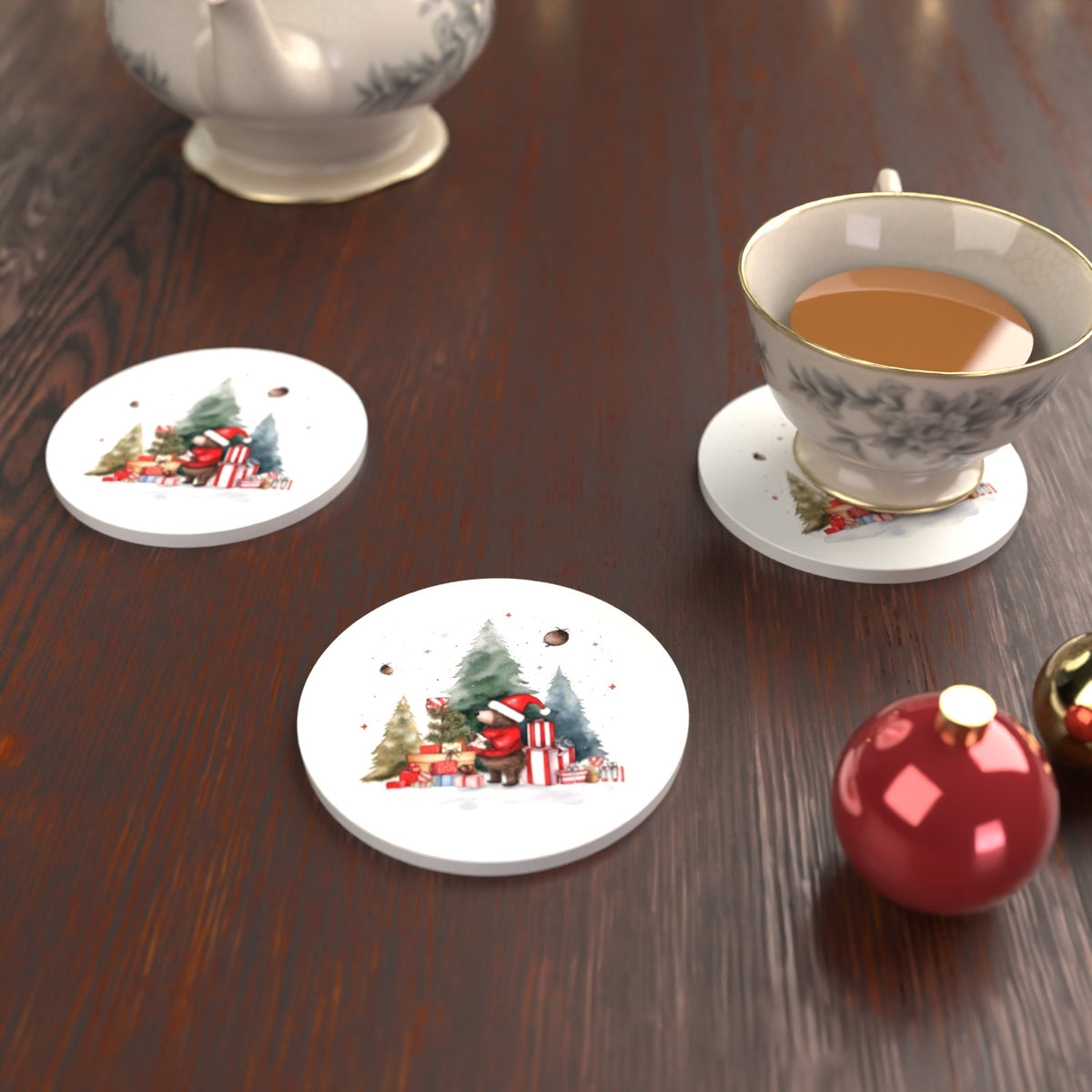 Little Bear with Christmas Presents Round Ceramic Coasters – Set of 6 – lifestyle mockup with a teacup