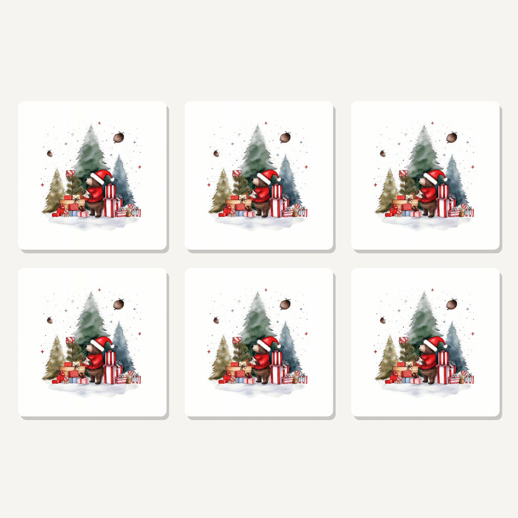 Flat lay of the little bear with christmas presents artwork on six square coasters