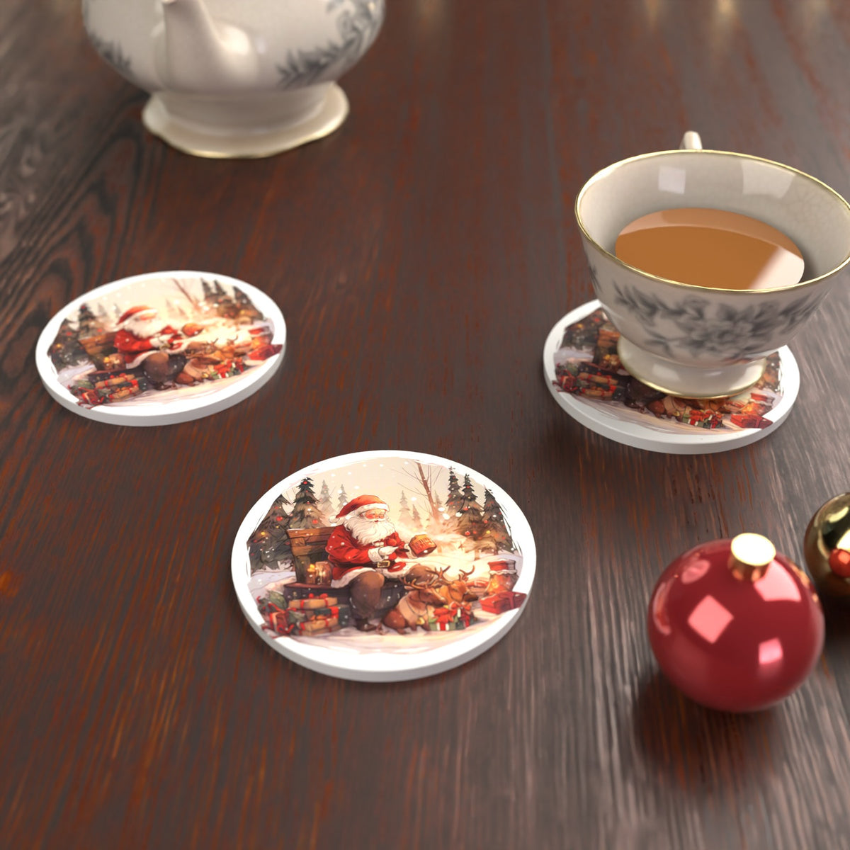 Father Christmas & Reindeer in the Woods Round Ceramic Coasters – Set of 6 – lifestyle mockup with a teacup