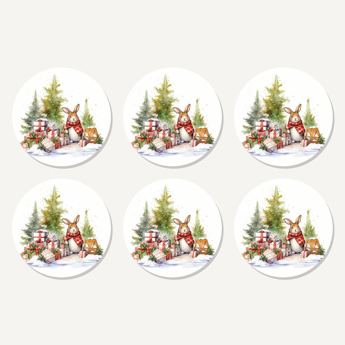 Flat lay of the christmas rabbit with presents artwork on six round coasters