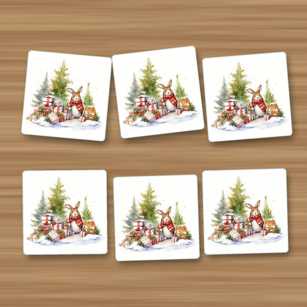 Christmas Rabbit with Presents square glass coasters, set of 6, on an oak coffee table