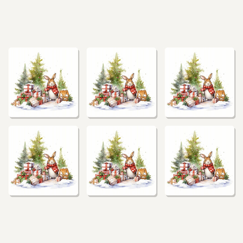 Flat lay of the christmas rabbit with presents artwork on six square coasters
