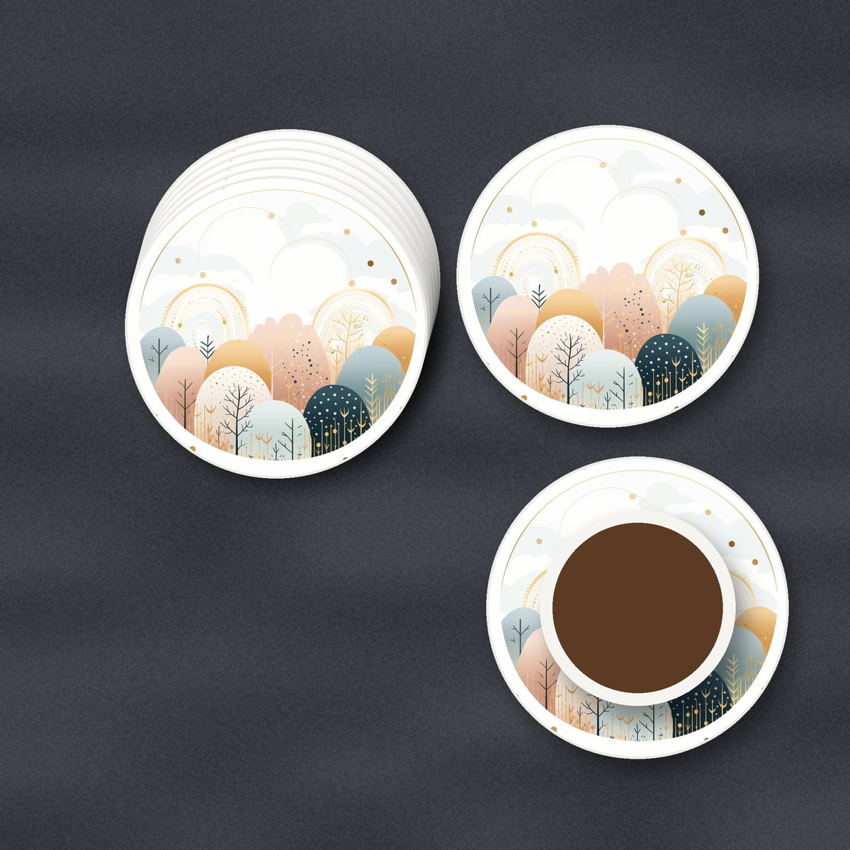 Minimalist Gold Winter Woodland Circle round ceramic coasters stacked on a slate kitchen worktop