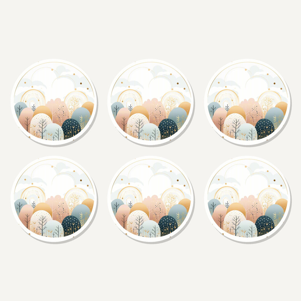 Flat lay of the minimalist gold winter woodland circle artwork on six round coasters