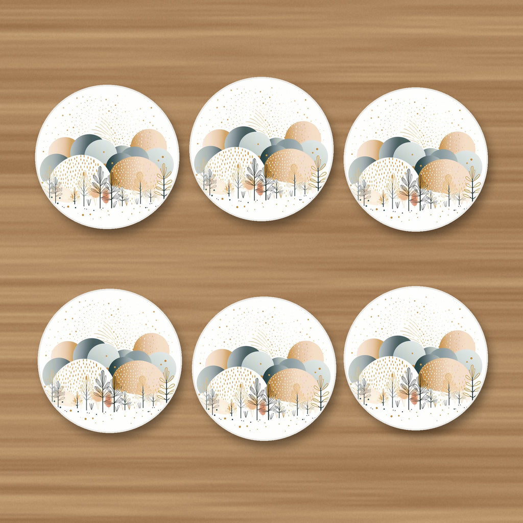 Minimalist Gold Winter Trees round ceramic coasters, set of 6, on an oak coffee table
