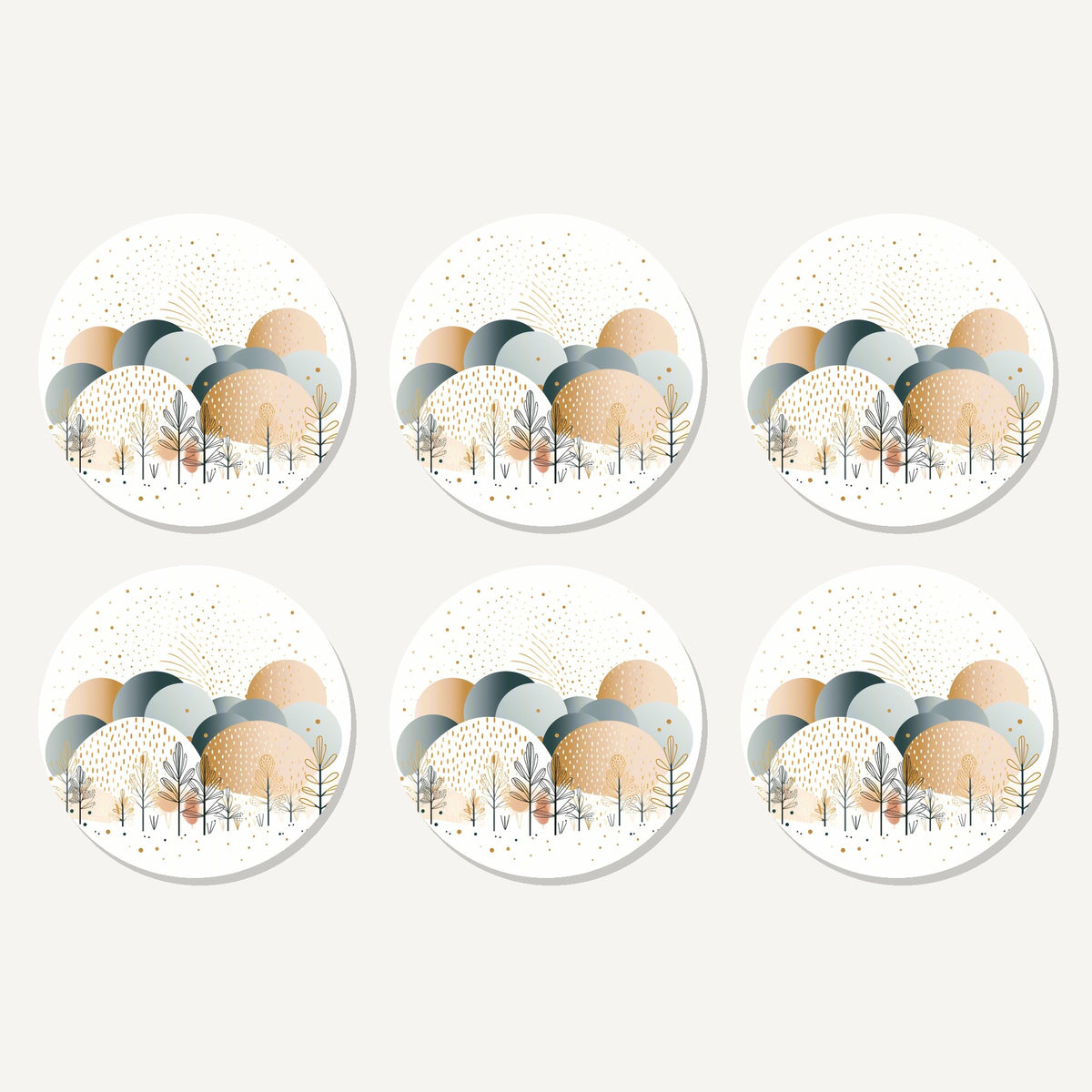 Flat lay of the minimalist gold winter trees artwork on six round coasters