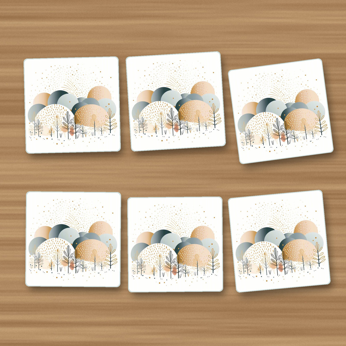 Minimalist Gold Winter Trees square glass coasters, set of 6, on an oak coffee table