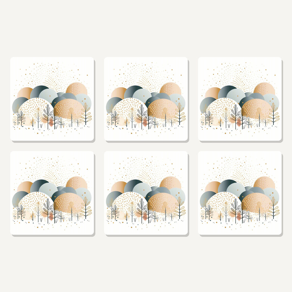 Flat lay of the minimalist gold winter trees artwork on six square coasters