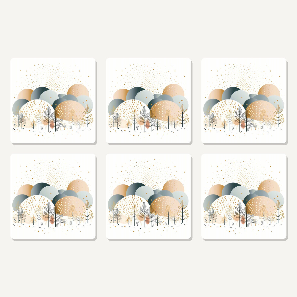 Flat lay of the minimalist gold winter trees artwork on six square coasters