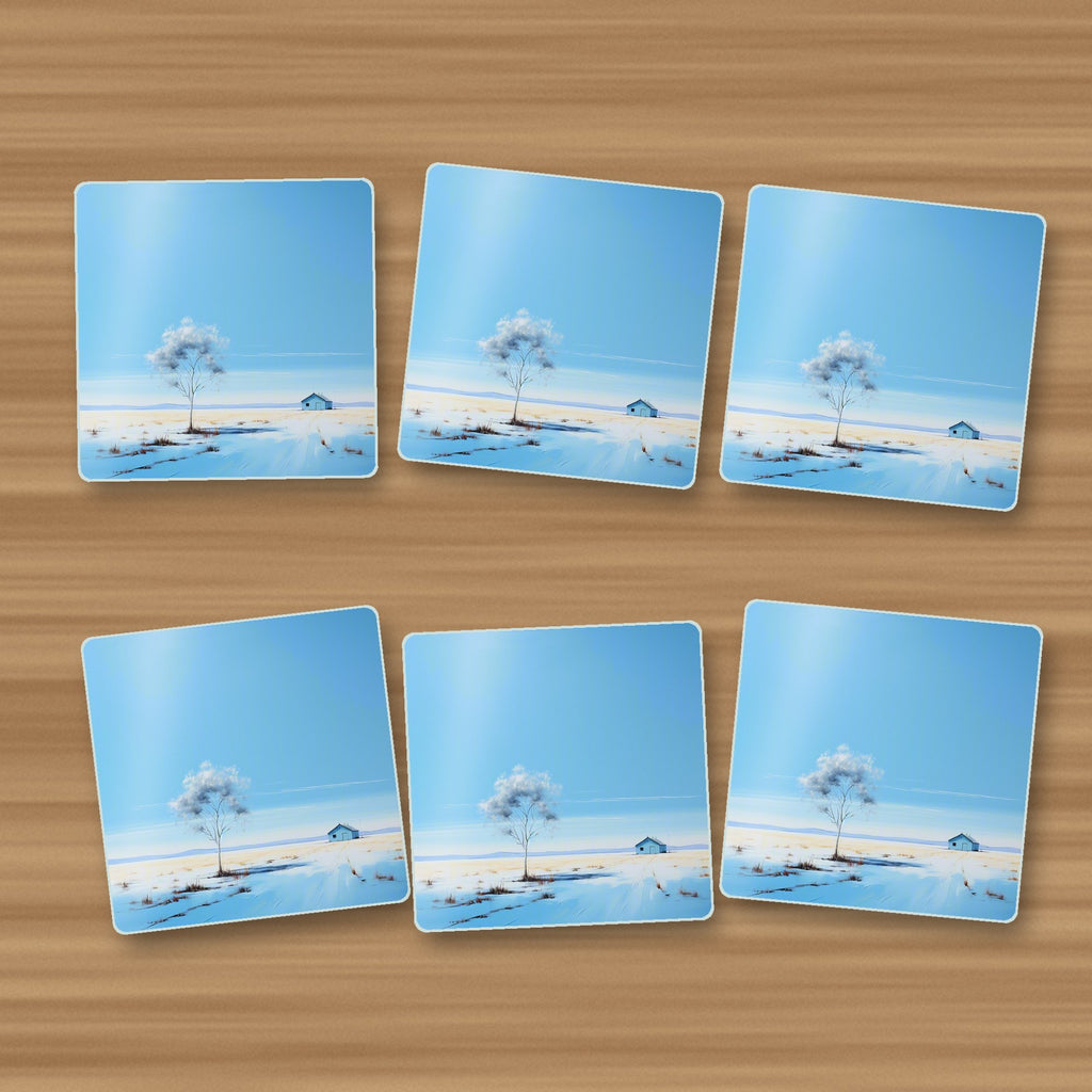 Lone Tree in a Snowy Field square glass coasters, set of 6, on an oak coffee table