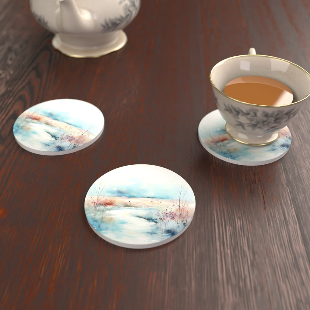 Watercolour Winter Riverbank Round Ceramic Coasters – Set of 6 – lifestyle mockup with a teacup