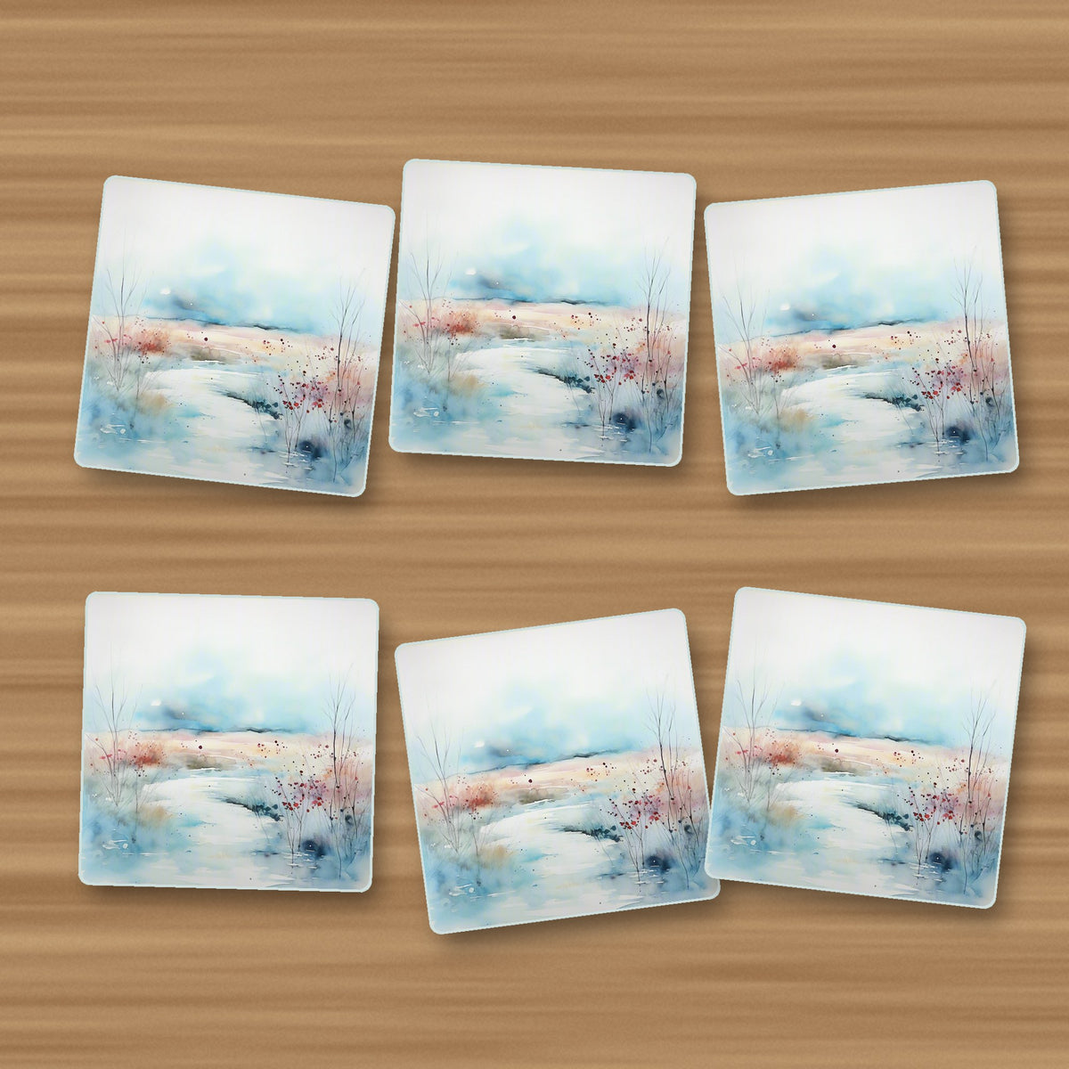 Watercolour Winter Riverbank square glass coasters, set of 6, on an oak coffee table