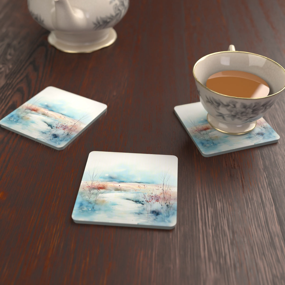 Watercolour Winter Riverbank Square Glass Coasters – Set of 6 – lifestyle mockup with a teacup
