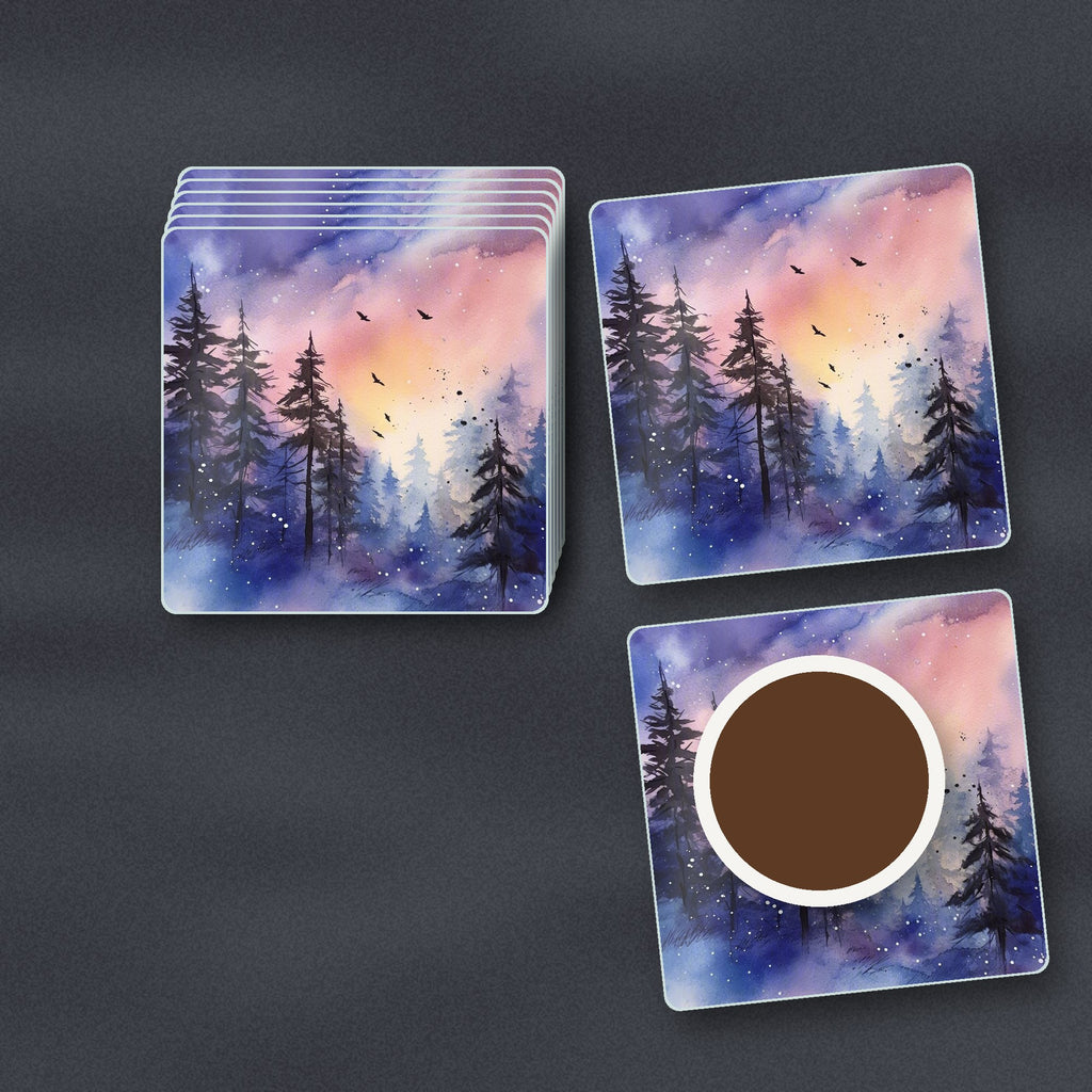 Watercolour Winter Pine Forest square glass coasters stacked on a slate kitchen worktop