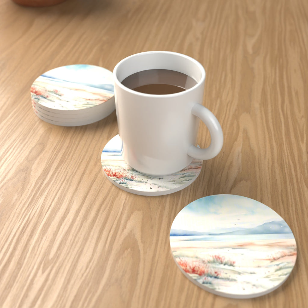 Watercolour Winter Shore Round Ceramic Coasters – Set of 6 – lifestyle mockup with a mug of coffee