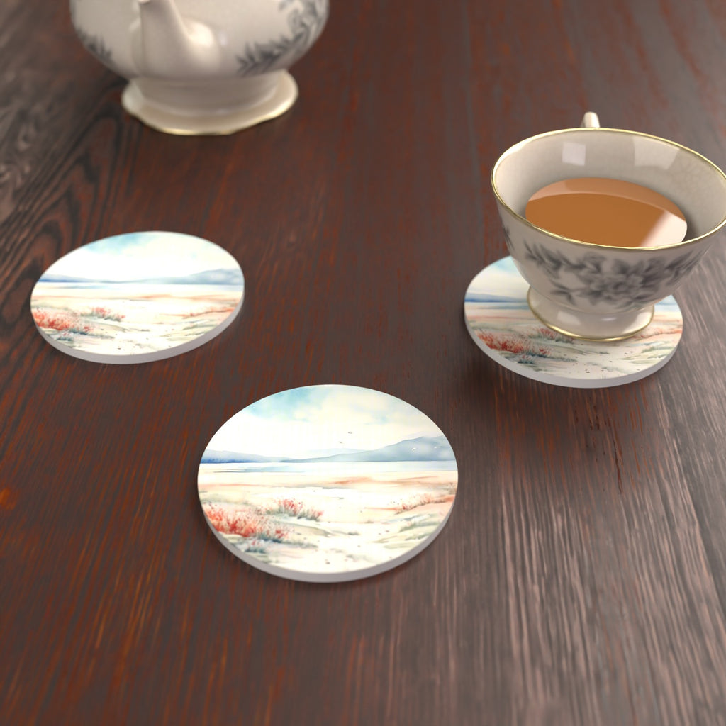 Watercolour Winter Shore Round Ceramic Coasters – Set of 6 – lifestyle mockup with a teacup