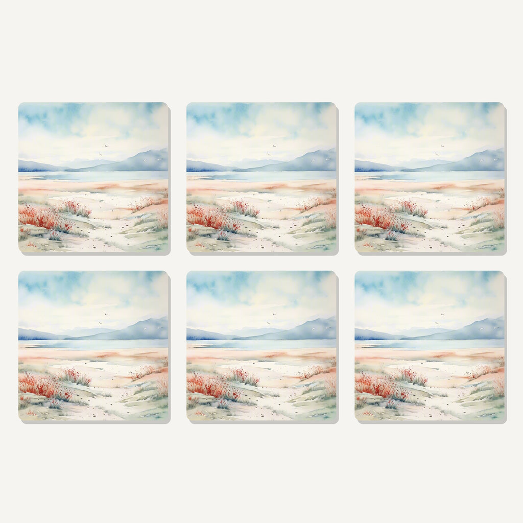 Flat lay of the watercolour winter shore artwork on six square coasters