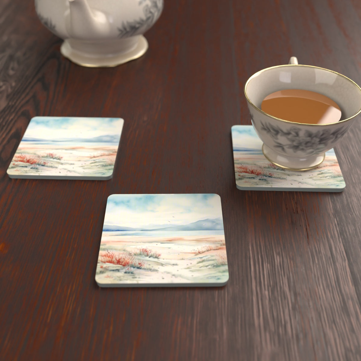 Watercolour Winter Shore Square Glass Coasters – Set of 6 – lifestyle mockup with a teacup