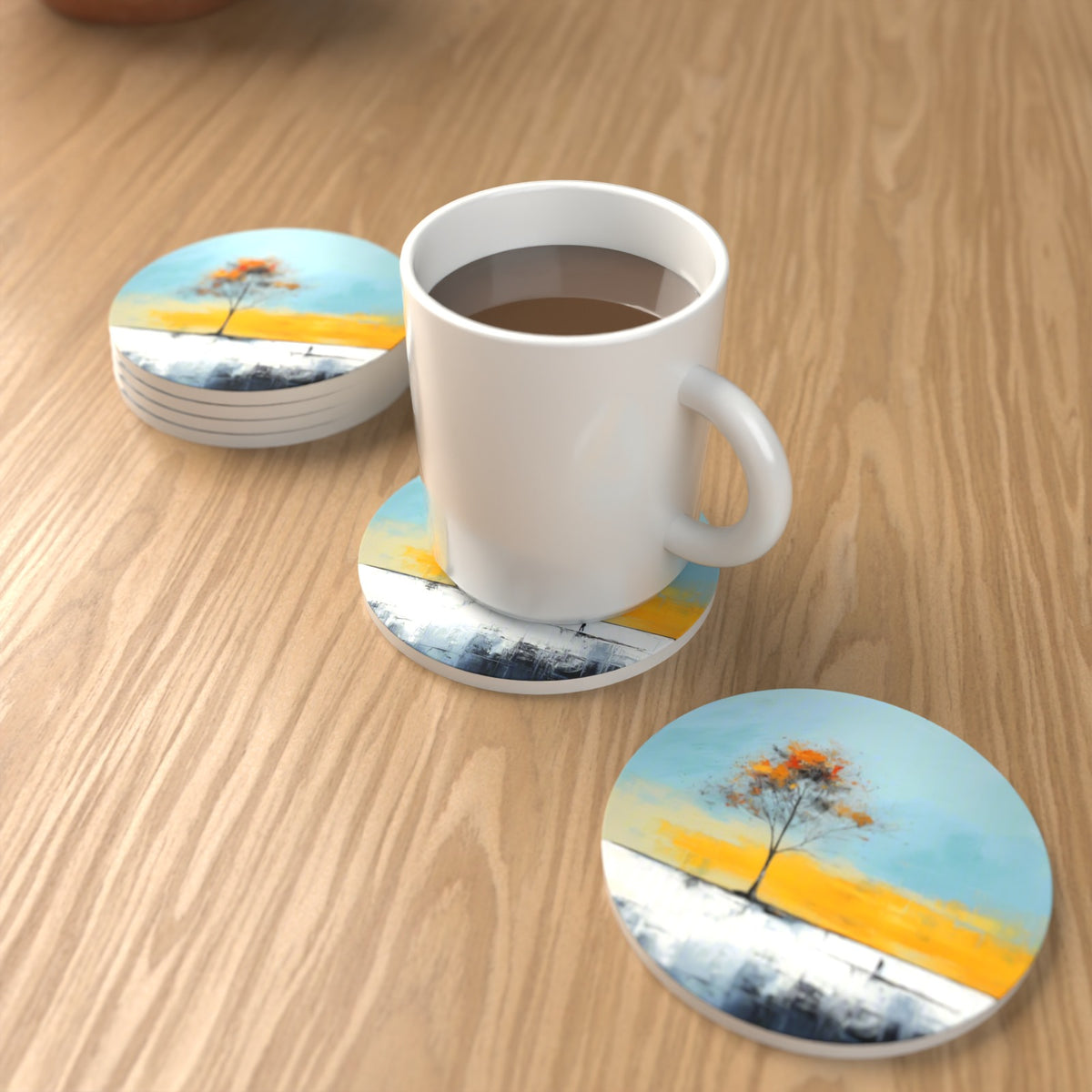Lone Tree Abstract Landscape Round Ceramic Coasters – Set of 6 – lifestyle mockup with a mug of coffee