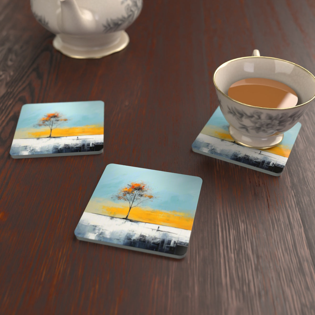 Lone Tree Abstract Landscape Square Glass Coasters – Set of 6 – lifestyle mockup with a teacup