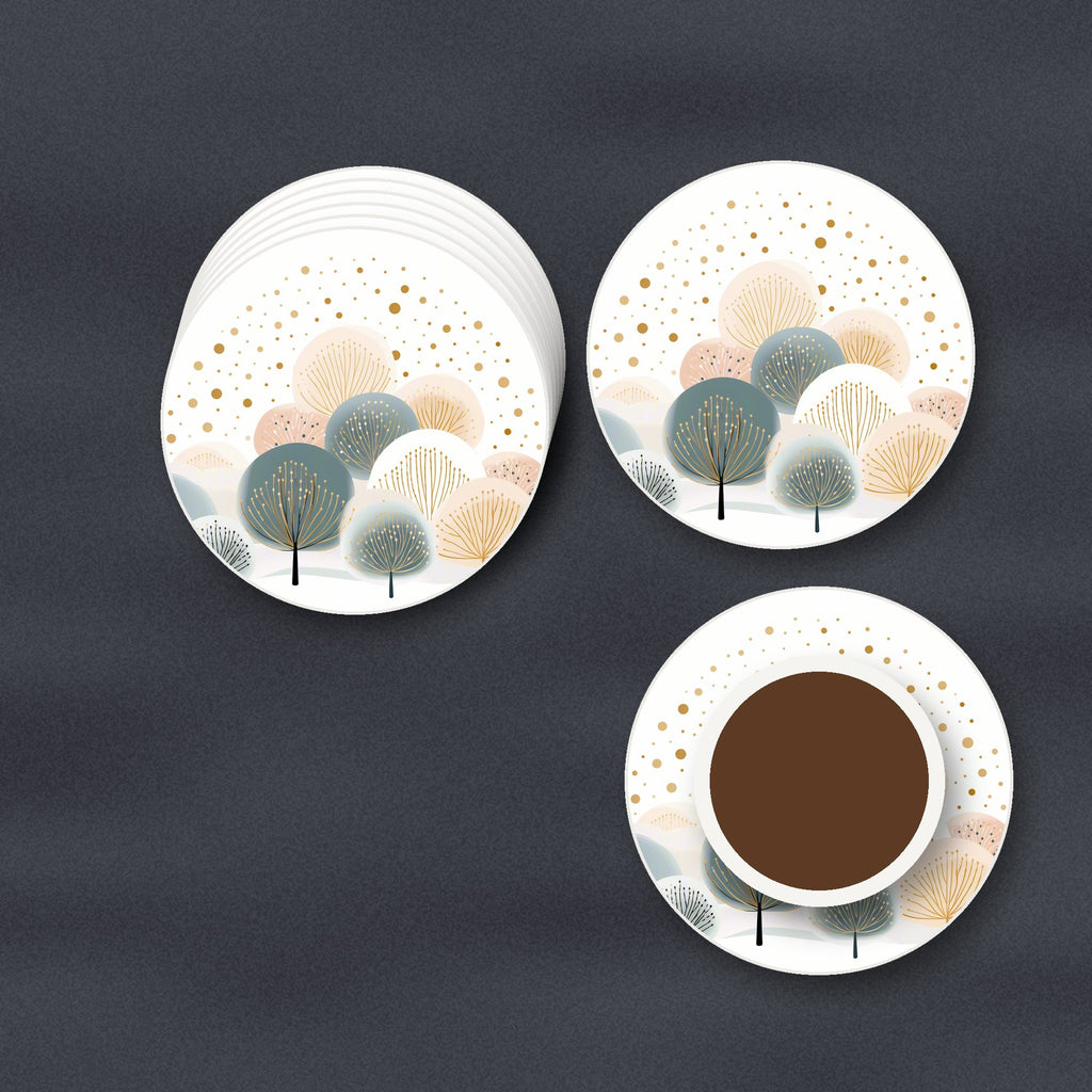 Minimalist Gold Dotted Trees round ceramic coasters stacked on a slate kitchen worktop