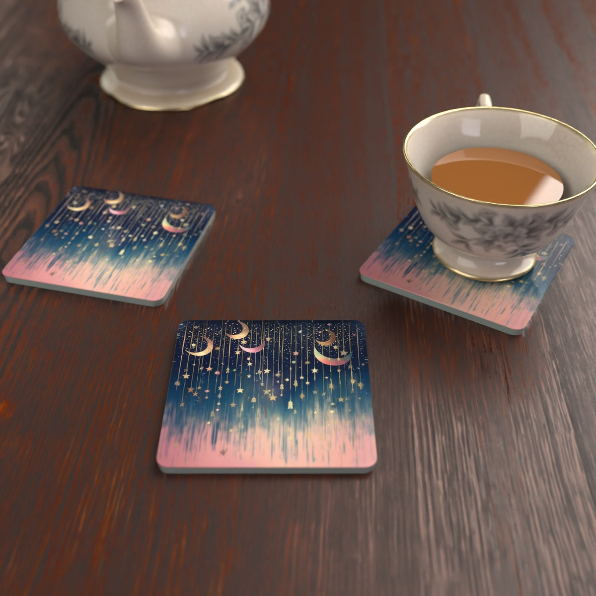 Hanging Moons & Stars Square Glass Coasters – Set of 6 – lifestyle mockup with a teacup