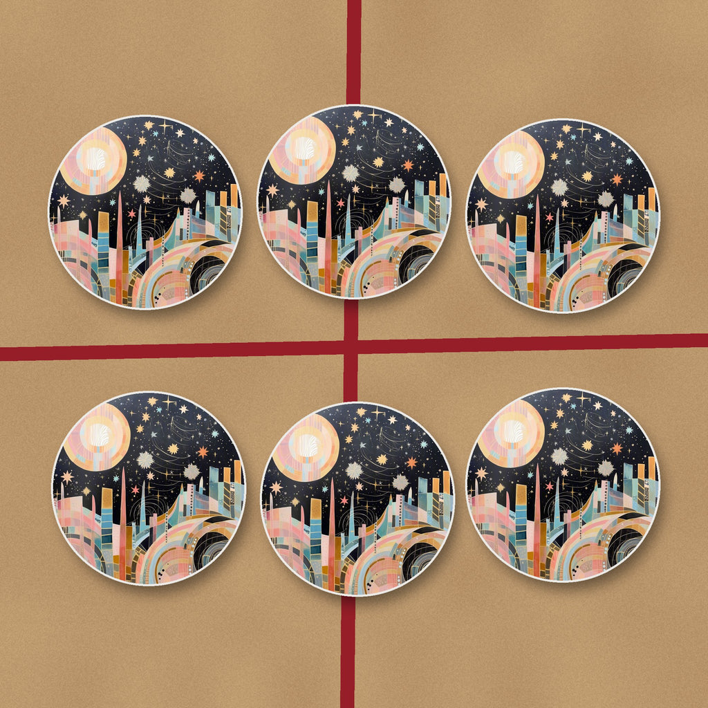 Celestial Pastel Skyline round ceramic coasters on kraft gift wrap