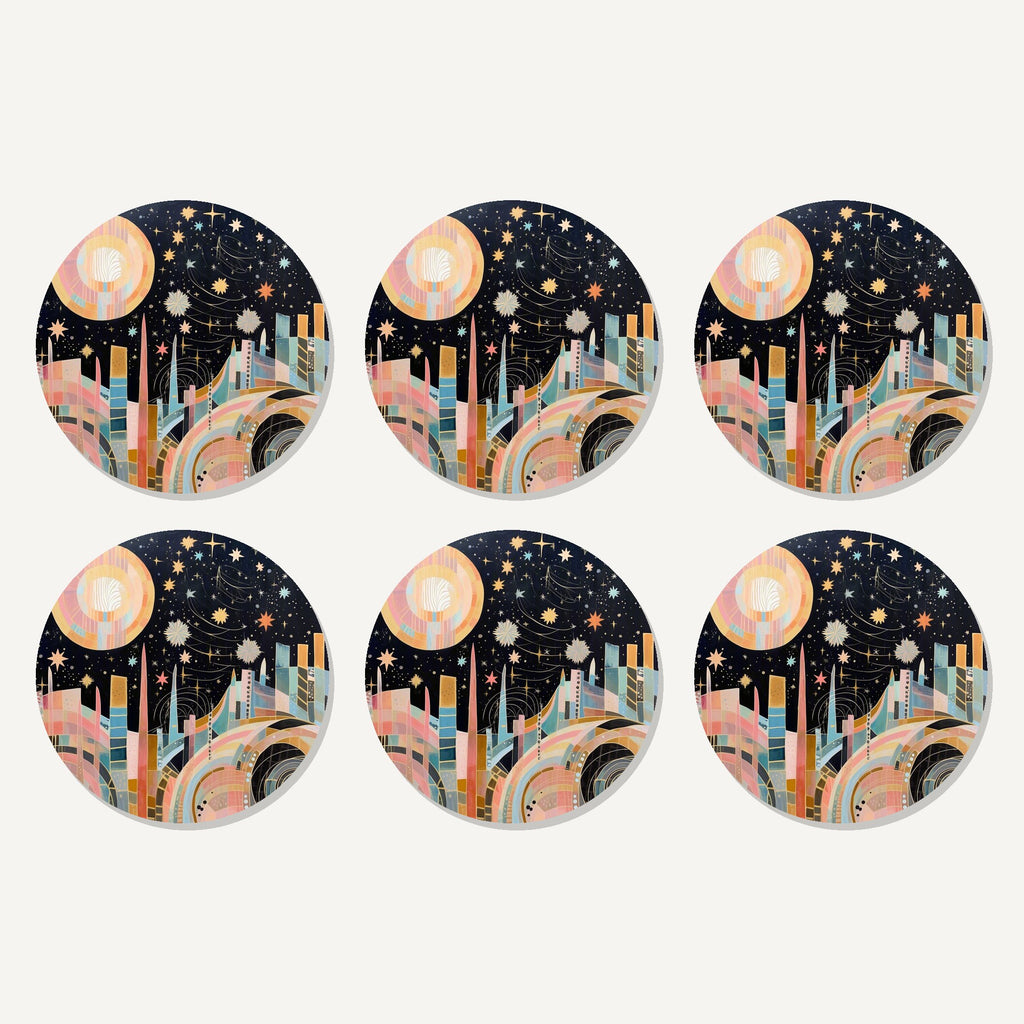 Flat lay of the celestial pastel skyline artwork on six round coasters