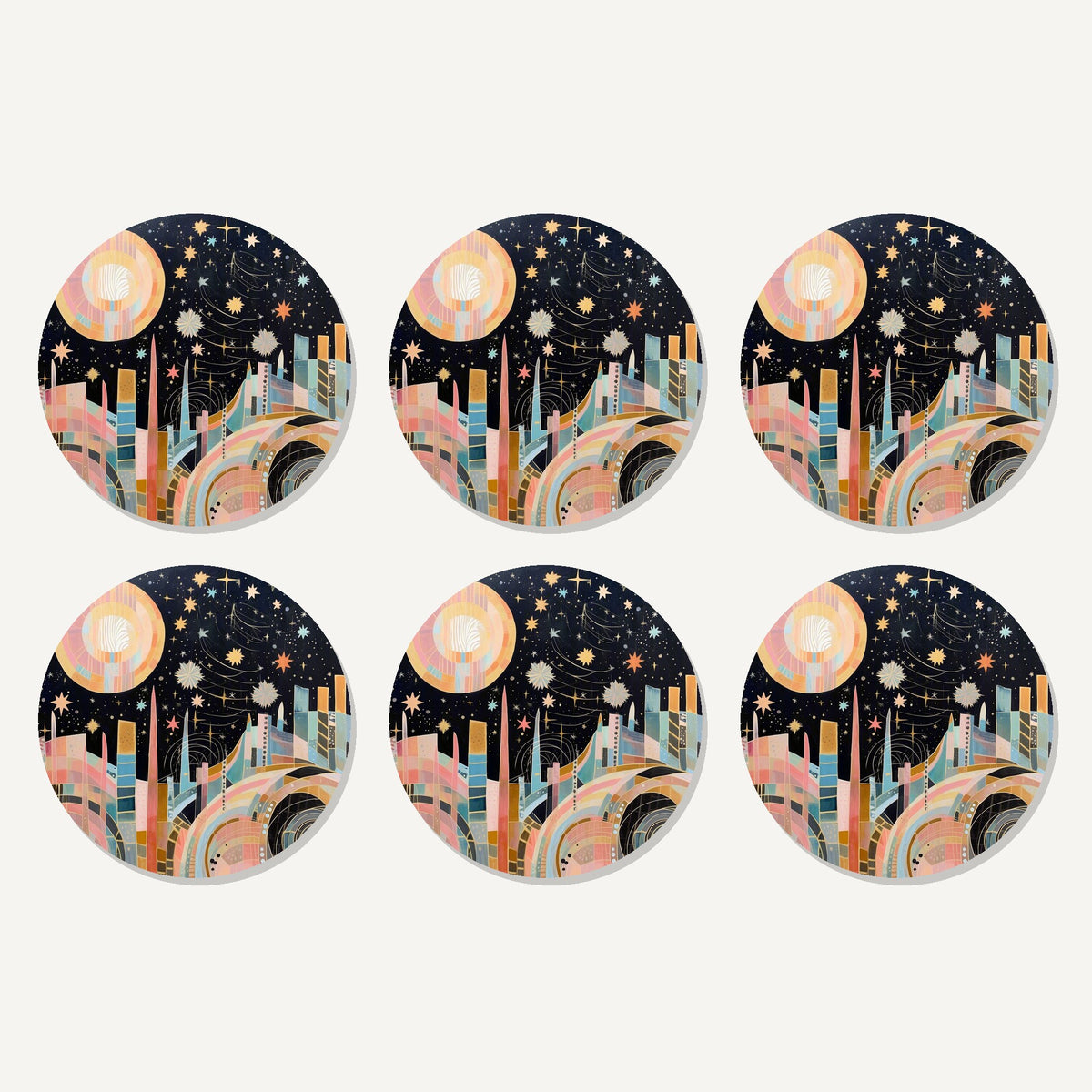 Flat lay of the celestial pastel skyline artwork on six round coasters