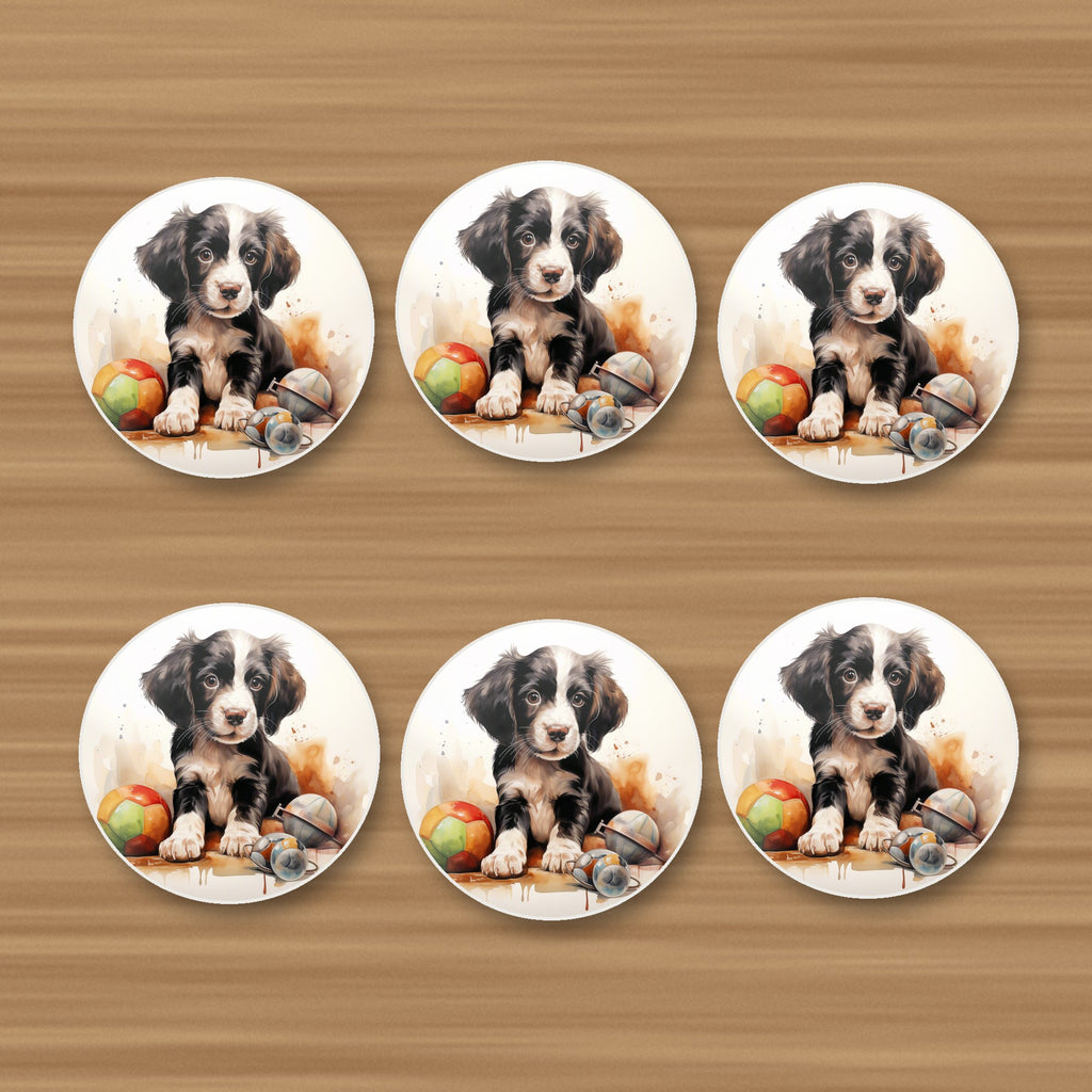 Springer Spaniel Puppy with Toys round ceramic coasters, set of 6, on an oak coffee table