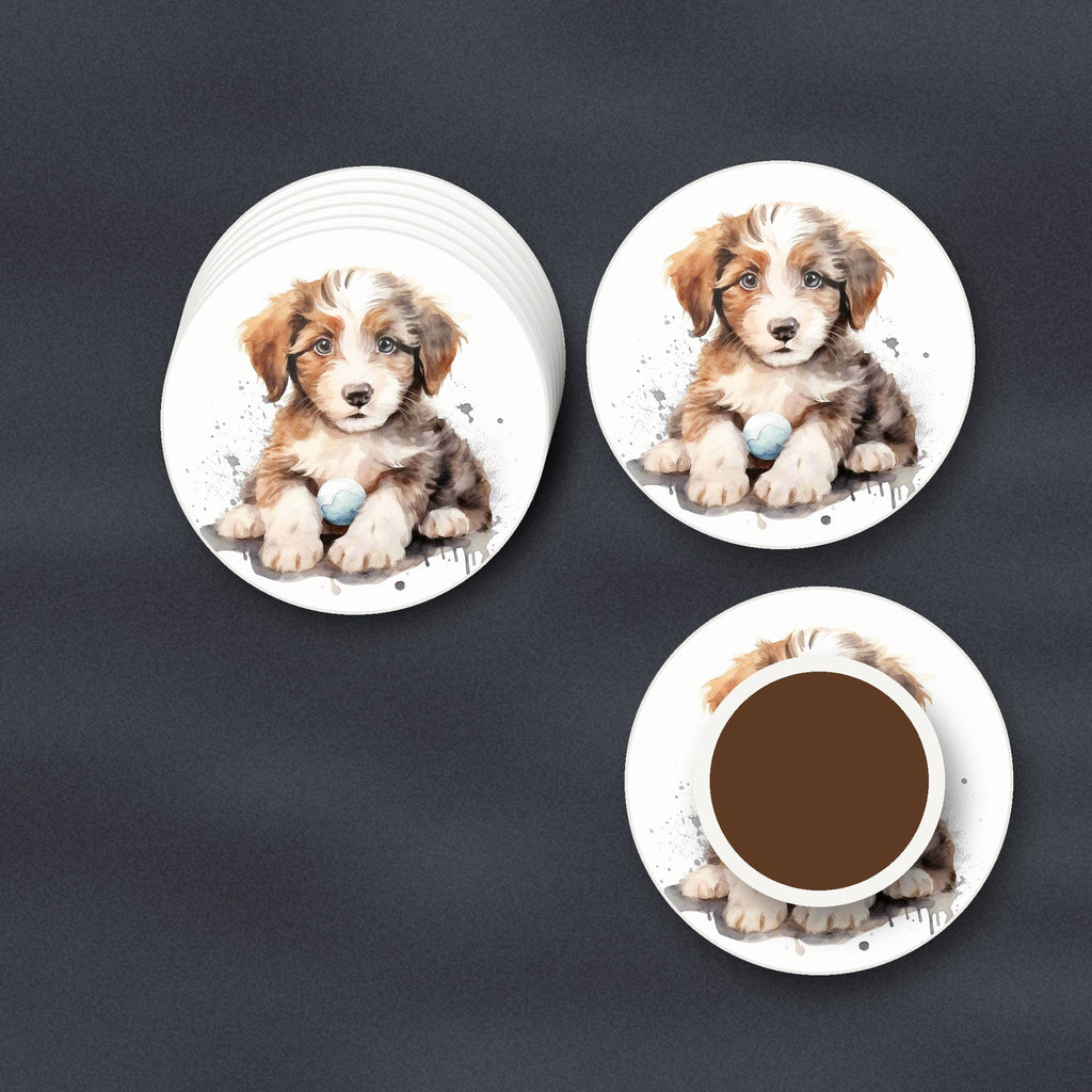 Watercolour Fluffy Puppy with Ball round ceramic coasters stacked on a slate kitchen worktop