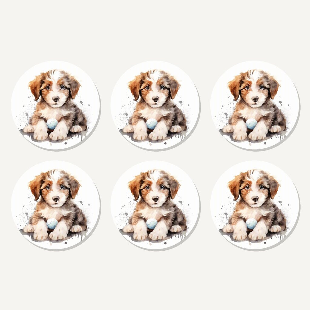 Flat lay of the watercolour fluffy puppy with ball artwork on six round coasters