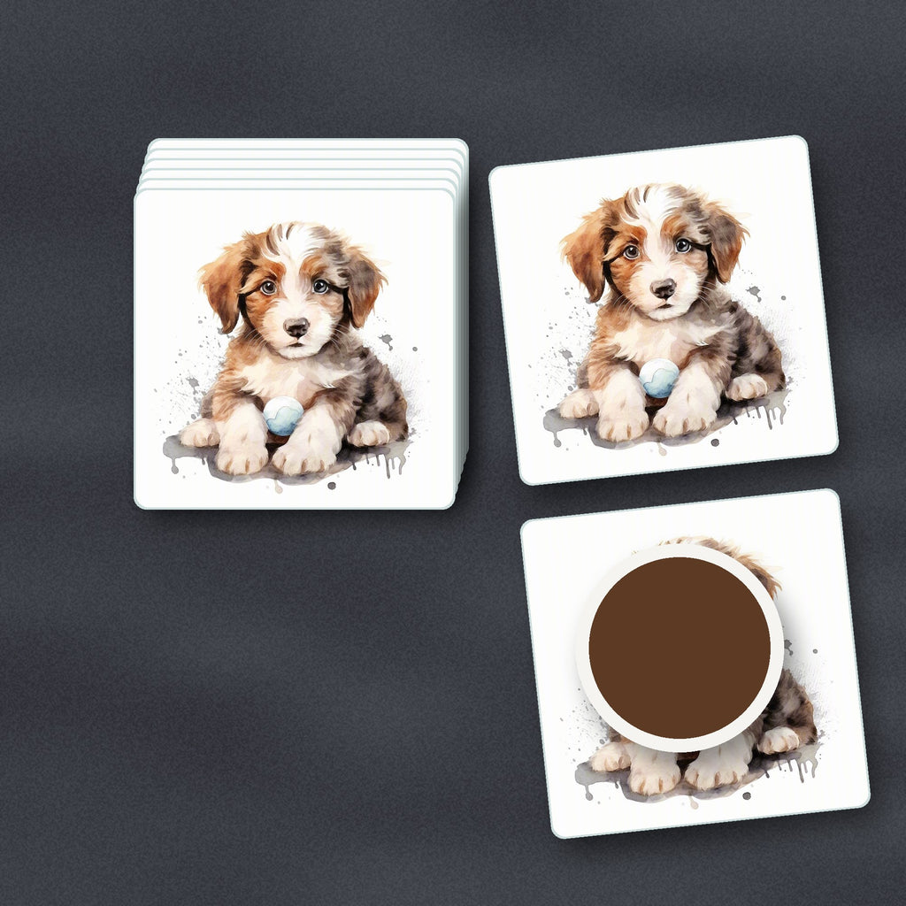 Watercolour Fluffy Puppy with Ball square glass coasters stacked on a slate kitchen worktop