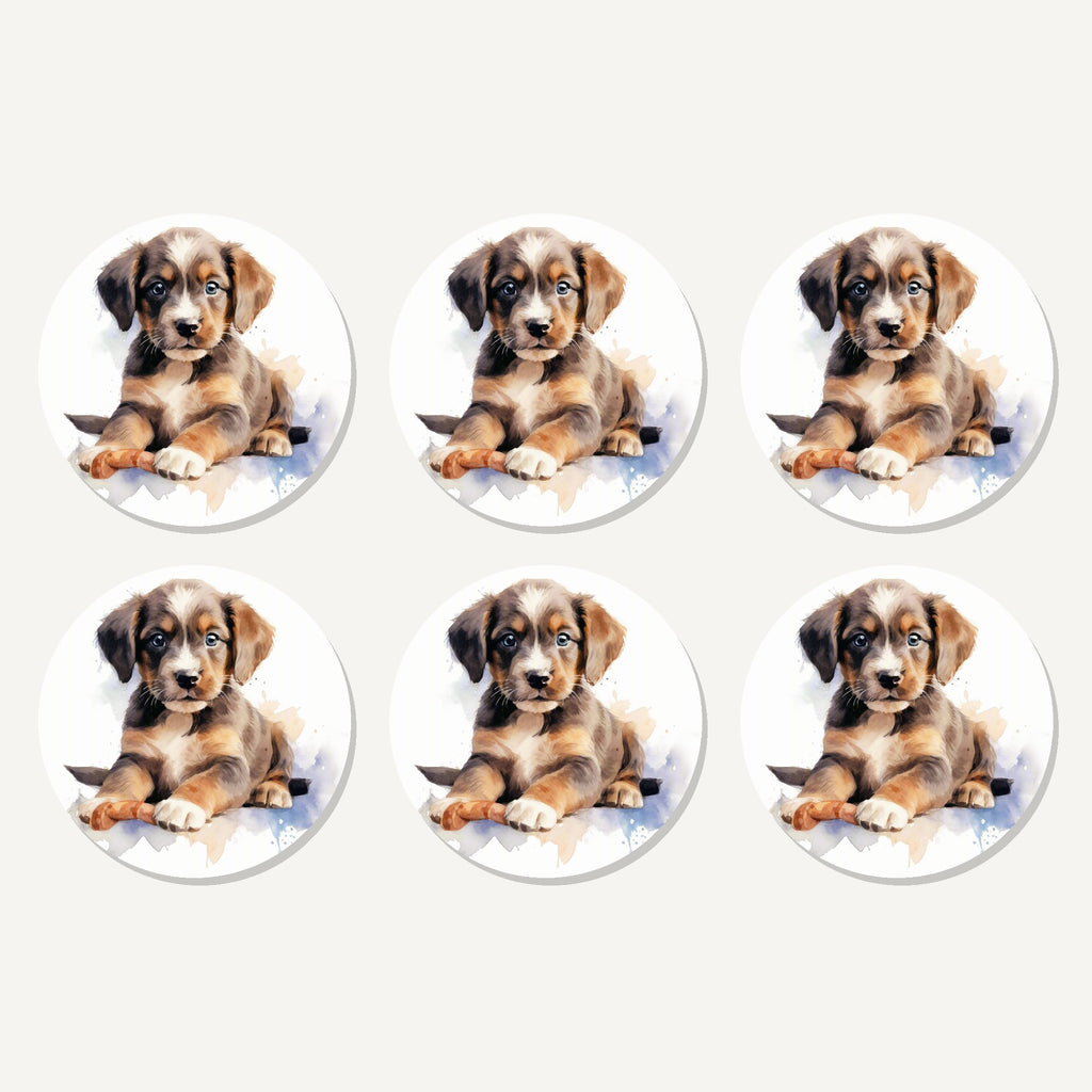 Flat lay of the watercolour brown puppy artwork on six round coasters