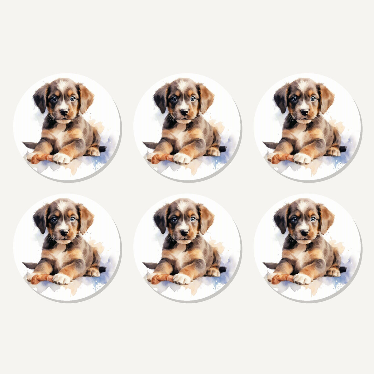 Flat lay of the watercolour brown puppy artwork on six round coasters