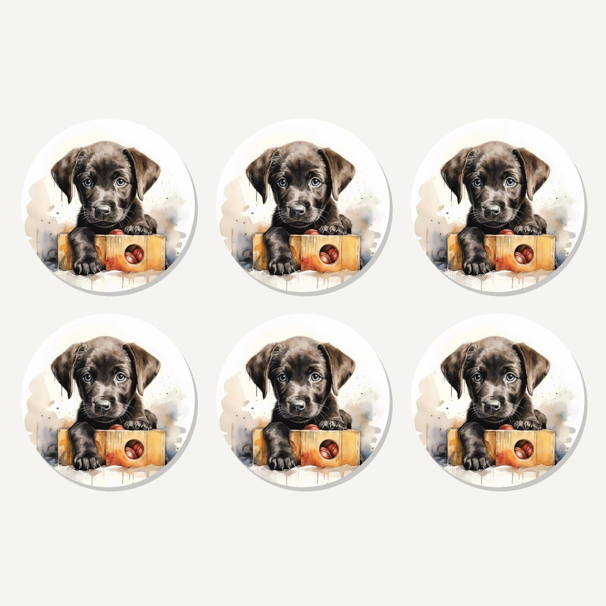 Flat lay of the black labrador puppy with toy box artwork on six round coasters