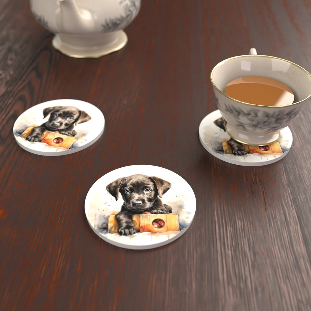 Black Labrador Puppy with Toy Box Round Ceramic Coasters – Set of 6 – lifestyle mockup with a teacup