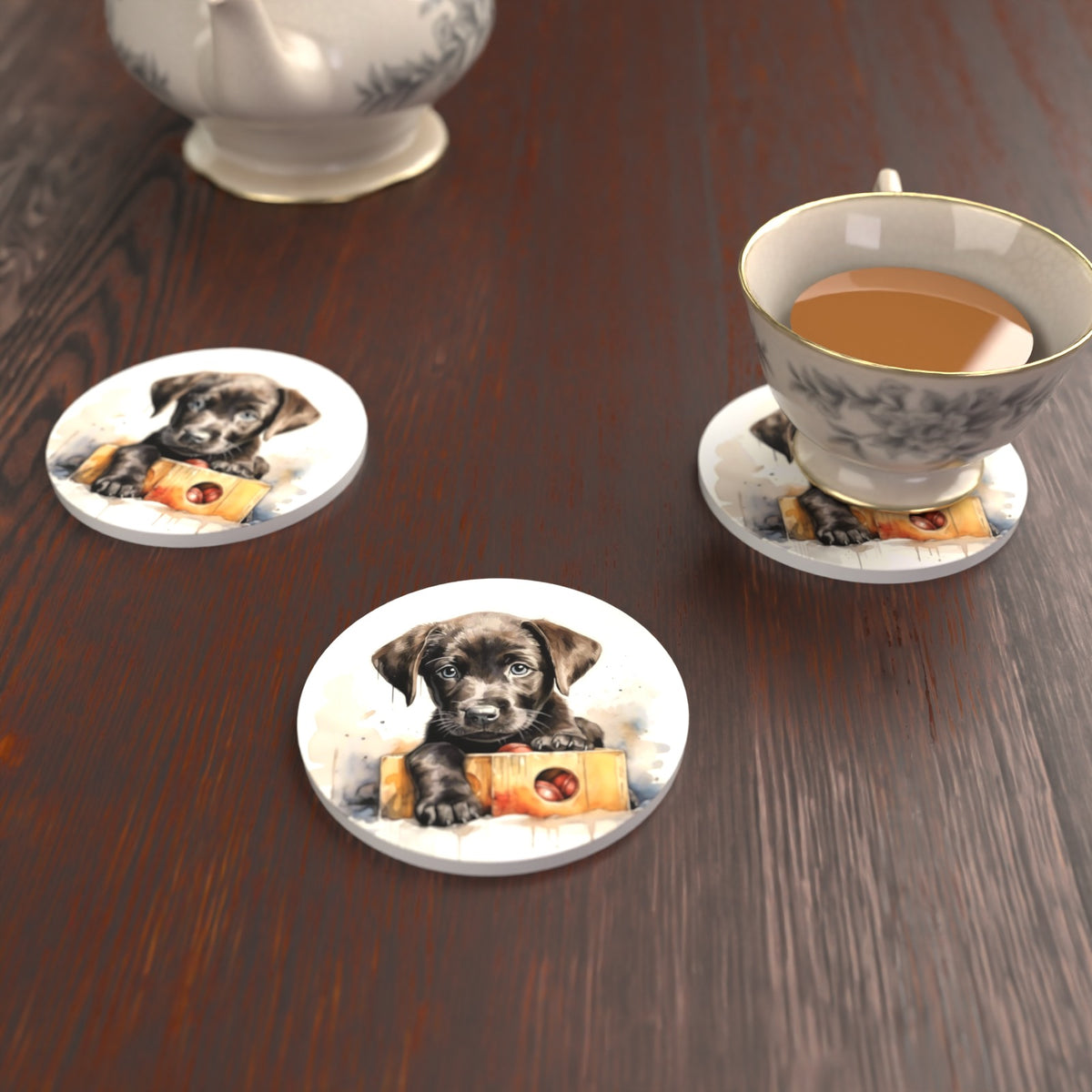 Black Labrador Puppy with Toy Box Round Ceramic Coasters – Set of 6 – lifestyle mockup with a teacup