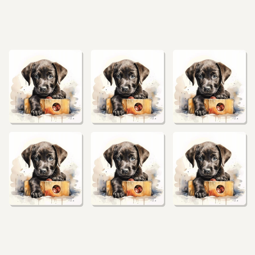 Flat lay of the black labrador puppy with toy box artwork on six square coasters