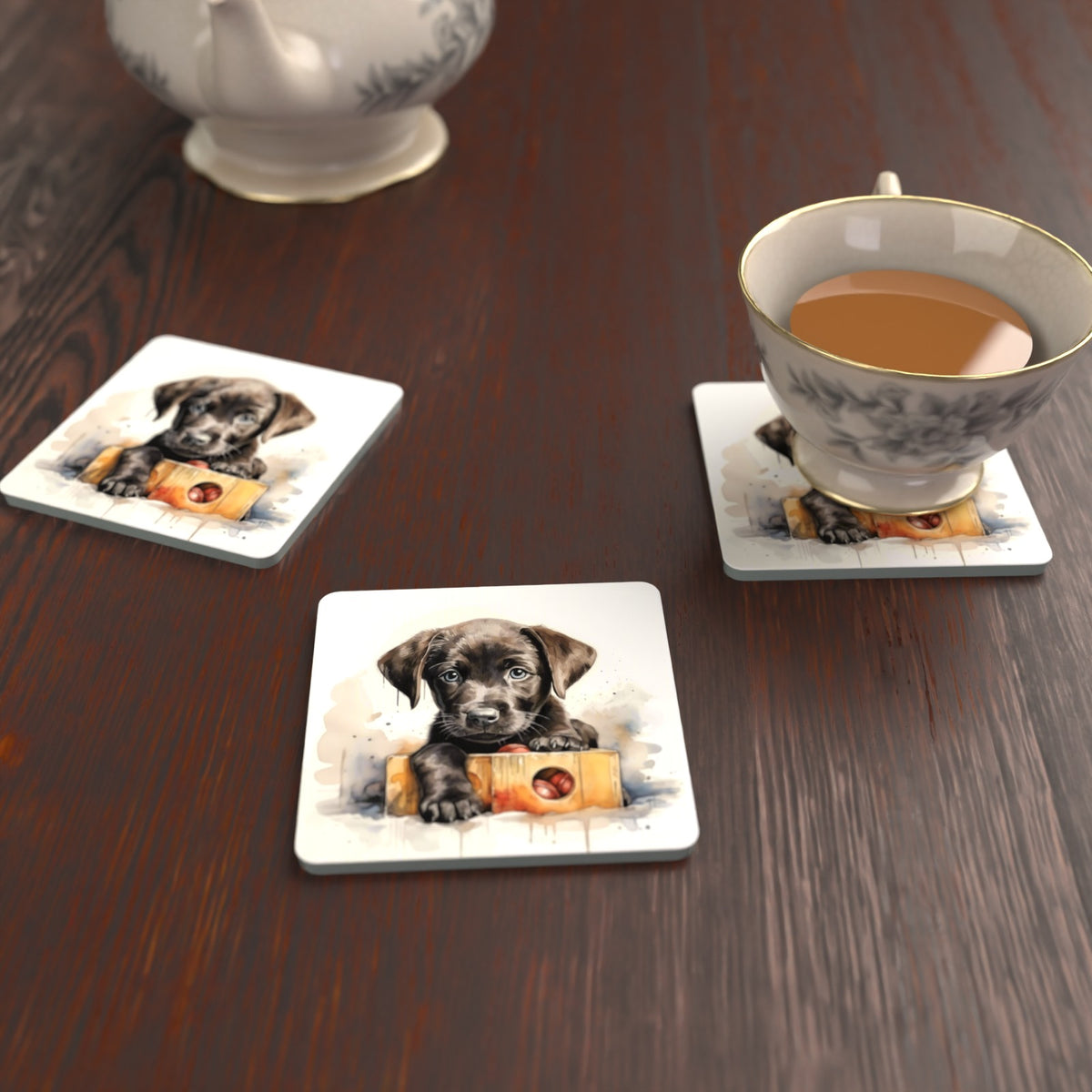 Black Labrador Puppy with Toy Box Square Glass Coasters – Set of 6 – lifestyle mockup with a teacup